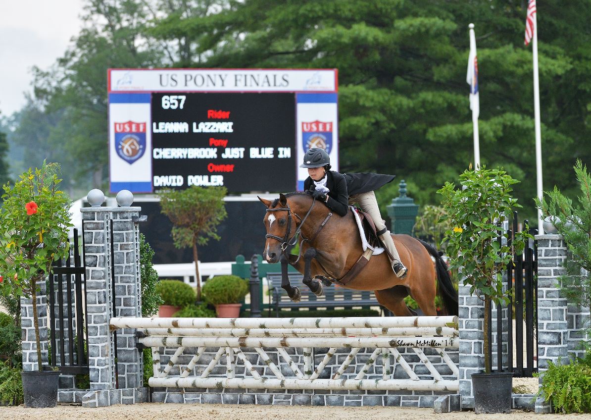In 2014, Leanna Lazzari made her debut at USEF Pony Finals riding Cherrybrook Just Blue In (pictured) and Goldhills Arresting Charm. Photo by Shawn McMillen Photography